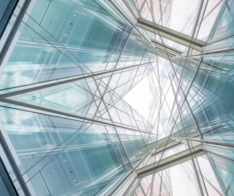 Kaleidoscopic image of intersecting lines and panes of glass from an office building. Exposure Therapy Designs works to keep the fee reasonable and is competitive with a well below-average fee within the San Francisco Bay Area.